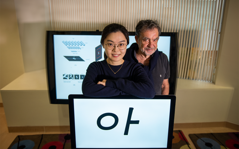 Yena Han (left) and Tomaso Poggio stand with an example of the visual stimuli used in a new psychophysics study. Photo: Kris Brewer